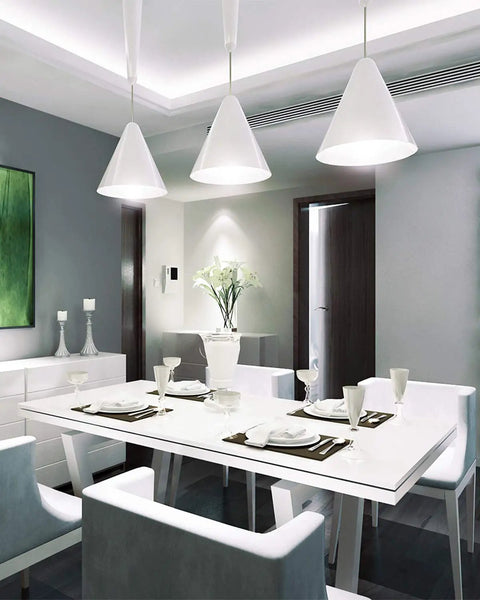 Modern dining room with Bright 5.5W LED B11 Candelabra Bulbs 5000K Daylight White illuminating the table and chandelier.