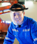 Man wearing Badass Heavy Duty Protective Visor With Rock Solid Impact Resistant Shield and Adjustable Spring Band Welding Hood.