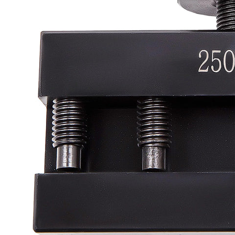 Black metal lathe tool post holder with two threaded posts and springs.