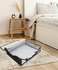 Lowkey Huge Underbed Storage Container And Clothes Organizer features grippy handles and smooth slide design on a rug.