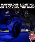 RGB LED Rock Lights Kit With 4 Pods Underglow controlled by phone app, highlighting truck with neon underglow at night.
