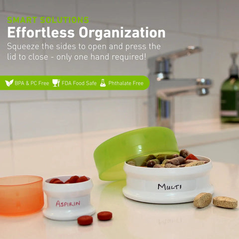 GoTubb Mini Storage Containers For Snacks And Grab And Go Travel Gear With One Hand Snap Lid, clear lids, filled with pills.