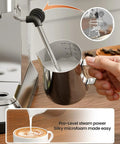 Grind Your Perfect Shot With This Compact Stainless Steel Espresso Machine Boasting 20 Bar Pressure milk frother in use with measuring jug.
