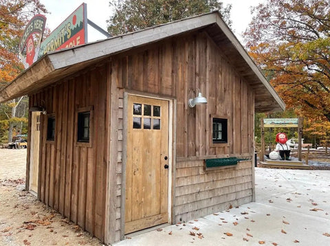 Ranchworn Aging Wood Stain Quick Turnaround Formula Dries In Half Hour on wooden building exterior for heavy duty coverage.