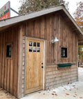 Straight Up Premium Aging Wood Stain In Ranchworn used on rustic wooden building exterior with a barn style finish.