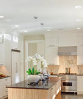 Modern kitchen with Ultra Slim LED Integrated Recessed Lighting Kit Four Pack 6 Watts Energy Star IC and Wet Rated.