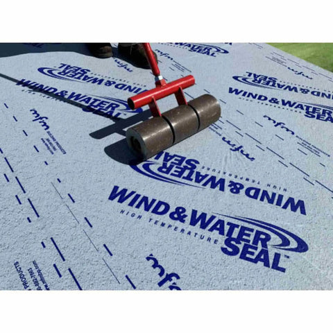 Heavy Duty Rubberized Asphalt Wind And Water Seal Underlayment Single Roll being installed with a roller on a roof.