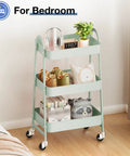 Three Tier Metal Rolling Cart With Lockable Casters For Living Room And Bath A Space Saving Mobile Storage Shelf For Narrow Spaces In Pale Green Smooth Rolling Casters For Quick Organization On The Go in a bedroom setting