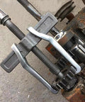 14 Inch Two Jaw Gear Puller Set With Adjustable Chrome Vanadium Steel Construction in use for gear removal