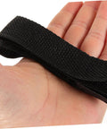 Close-up of hand holding adjustable strap from 8 Pack Garden Aerator Shoes Straps Durable Lawn Aerating Sandals For Easy Soil Loosening Thatch Reduction Fits All Foot Sizes Outdoor Lawn Care Tool Kit.