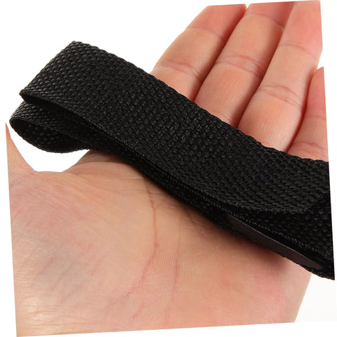 Close-up of hand holding adjustable strap from 8 Pack Garden Aerator Shoes Straps Durable Lawn Aerating Sandals For Easy Soil Loosening Thatch Reduction Fits All Foot Sizes Outdoor Lawn Care Tool Kit.