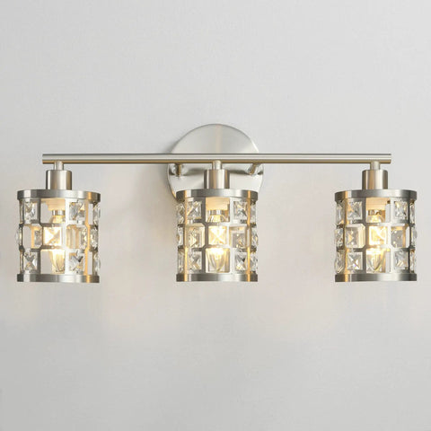 Three Light Brushed Nickel Vanity Light Fixture With Cylinder Crystal Shades Over Mirror Slick Modern Wall Sconce