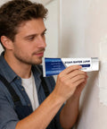 Man applying Easy Drywall Crack Repair Paste Kit With Spatula - Quick-Dry Wall Patch Putty to interior wall