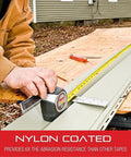 Heavy Duty Retractable Imperial Pocket Tape Measure With Nylon Coating in use on construction site