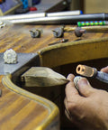 Pro Grit Diamond Grinding Wheel For Electric Glass Grinders With Brazed Abrasive Disc in use on a decorative metal piece.