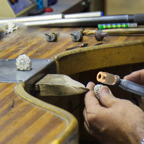 Pro Grit Diamond Grinding Wheel For Electric Glass Grinders With Brazed Abrasive Disc in use on a decorative metal piece.