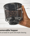 Barista Grade Conical Burr Electric Coffee Grinder With 12 Oz Capacity slightly removed black hopper in hand