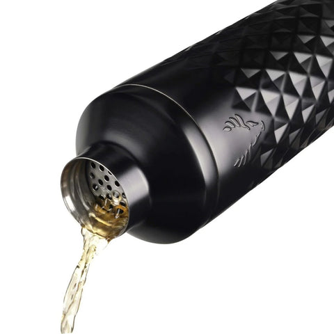 Paragon Vacuum Insulated Cocktail Shaker with Built In Strainer pouring liquid, geometric black stainless steel design