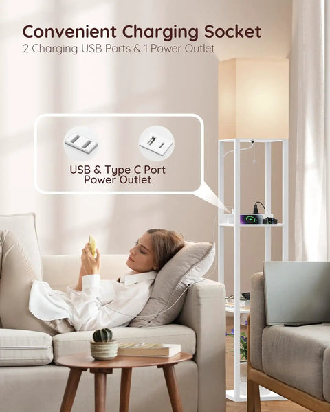 Solid Wood Shelf Floor Lamp With 2 Charging Ports And 1 Power Outlet, in white, with beech shelves, next to woman relaxing on sofa