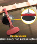 Hands Free Suck N Clamp Adjustable Cup Clamps Pack Of 6 for Windshield Repair securing a panel with suction cup.