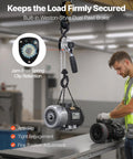 Manual lever chain hoist, 1/2-ton capacity, with steel chain and black handle lifting an industrial motor in a workshop