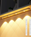 LED Under Cabinet Lights With Motion Sensor USB Rechargeable Cat Eye Style Light Bar illuminating a kitchen counter with soft white glow
