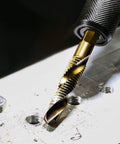 Titanium Coated Drill Tap Bit from Six Piece All In One Time-Saving Combination Drill Tap Bit Set in action on metal surface