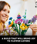 Brick Built Wildflower Bouquet Building Set For Adults Realistic Faux Flowers For Indoor Home Decor Desk Or Kitchen Display Creative Gift Idea For Birthdays And 18 Plus Vase Not Included, woman holding 939-piece colorful brick flower bouquet