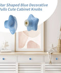 Set Of Six Star Shaped Ceramic Cabinet Knobs With Glossy Finish For Kitchen Drawers And Dressers Totally Swoon Worthy Home Refresh Upgrade Giving Your Furniture Major Glow Up Matching Mounting Hardware Included Vintage Nordic Style Accents on a white dresser.