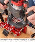 Ultra Premium Adjustable Dual Fence Mortise Base For Plunge Routers With 3/8 Guide Rods in use for precise mortise cutting.