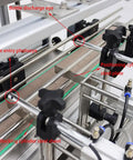 Close-up of Heavy Duty Smooth Operator Double Nozzle Paste Filling Machine Stainless Steel components and photoelectric sensors.