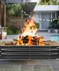 48 Inch Beast Heavy Duty Square Fire Pit Ring For Outdoor Use burning wood near patio with furniture and poolside view.