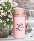 Pink 800ml insulated water bottle with tea infuser on table, "Lucky Every Day" text, leakproof vacuum-sealed stainless steel flask