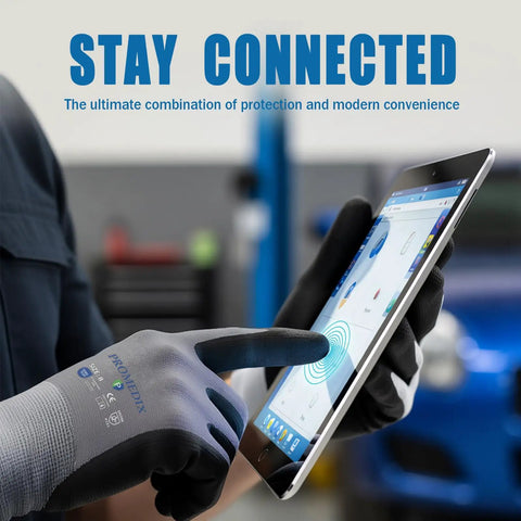 Person using touch screen with Nitrile Coated Work Gloves With MicroFoam Grip, Seamless Knit Nylon, Medium Size M 12