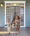 Children and a dog running through Reinforced Magnetic Screen Door 39x82 Inches Heavy Duty Hands Free Full Frame With Hook And Loop Strips