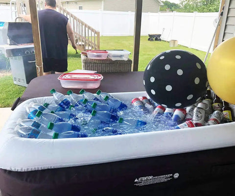 Inflatable Serving Bar For Summer Parties With Ice Chiller, Buffet Station, Drink Holder, bottles and cans of drinks inside, outdoor setting