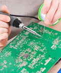 Person using 0.8mm Lead Free Solder Wire With Rosin Core For Electronics DIY Projects Makers And Soldering Nerds 100g Reel Sn Ag Cu Alloy 99 0.3 0.7 Flux 2 Percent Melts Smoothly At About 217C Ideal For PCB Repairs And Tiny Solder Joints on circuit board