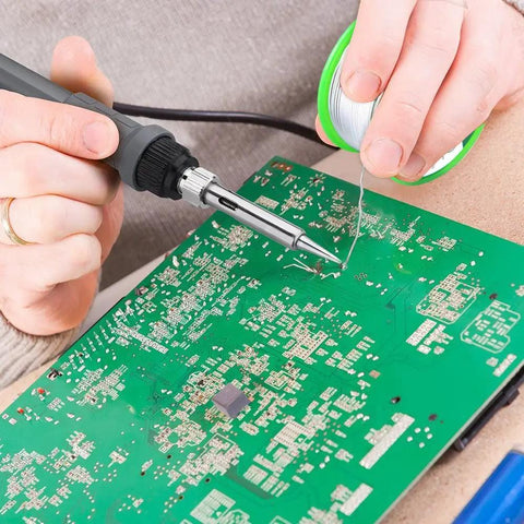 Person using 0.8mm Lead Free Solder Wire With Rosin Core For Electronics DIY Projects Makers And Soldering Nerds 100g Reel Sn Ag Cu Alloy 99 0.3 0.7 Flux 2 Percent Melts Smoothly At About 217C Ideal For PCB Repairs And Tiny Solder Joints on circuit board