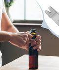 Person using Mini Stainless Steel Pocket Pry Bar Crowbar EDC Tool Five Pack Grab And Go Multifunction Survival Opener on bottle