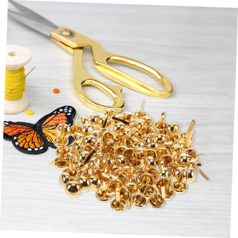 Versatile Craft Kit 100 Pcs Round Mushroom Brads And Mini Paper Fasteners with scissors and thread on table