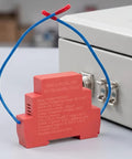 Rock Solid Automatic Aerosol Fire Extinguisher With Advanced Heat Sensor And Quick Flame Detector Tech in red with blue wire.