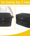 Two Layer Golf Trunk Organizer with Ventilated Shoe Compartment, black, shown being carried by two handles.