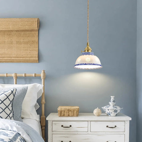 Ceramic Blue and White Pendant Light,Porcelain Light Fixture Kitchen Island hanging above a bedside table in a cozy bedroom.