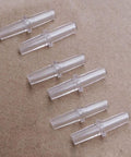 Six clear plastic connectors from Pro Grade Aquarium Airline Tubing Connectors Set 40 Pack No Fuss Y T L I Adapters For 3 16th Inch Air Lines.