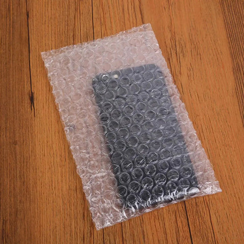 200 Pack 10x15 Cm Double Sided Bubble Padded Mailer Envelopes shockproof waterproof on table with phone inside
