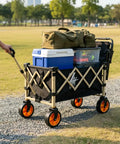 Heavy Duty Outdoor Folding Utility Wagon With 125 Liter Capacity And 600D Oxford Zero Hassle Folding Design rolls loaded with gear on a gravel path.