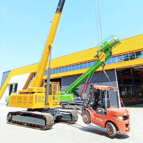 Portable Crawler Crane With 3 Ton Hydraulic Lift And 2 5 Ton Electric Hoist Featuring 360 Degree Spin lifting a forklift outdoors.