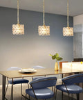 Dining room with three Dope Gold Crystal Pendant Lights With Adjustable Cord Modern Hanging Ceiling Fixture
