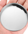 Ceramic bearing balls, black silicon nitride Si3N4, 2.381 mm (3/32 in), 200 pcs, in metal tin lid (front view).