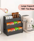 Go-To Tea Bag Organizer Rack With 3-Tier Bamboo Display next to coffee station, holds 180 plus tea bags, black finish.